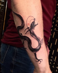 paint brush style dragon tattoo